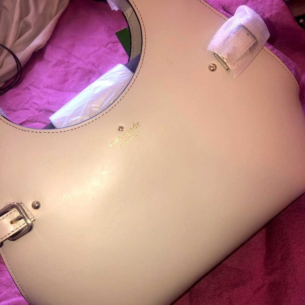 Kate spade hand bag, never worn, cream color